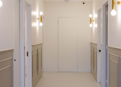 Sophisticated corridor at Glow Aesthetics Collective in Ingle Farm, South Australia, AU, featuring chic lighting.