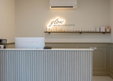 Reception area of Glow Aesthetics Collective in Ingle Farm, South Australia, AU with product display.