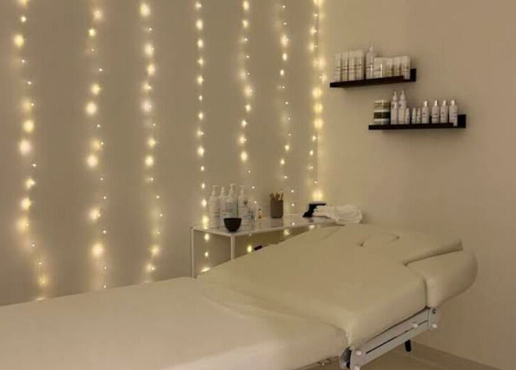 Elegant treatment room at Glow Aesthetics Collective, Ingle Farm, South Australia, AU with ambient lighting.
