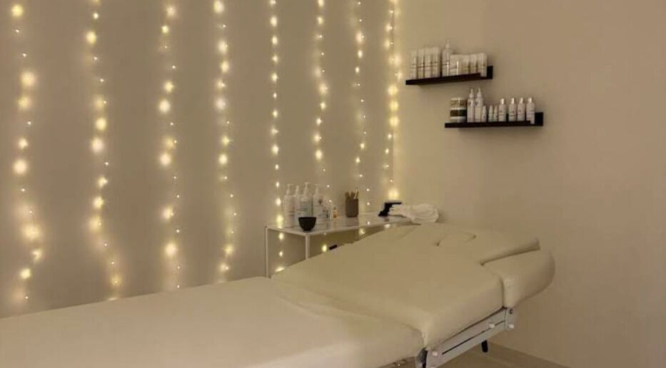 Elegant treatment room at Glow Aesthetics Collective, Ingle Farm, South Australia, AU with ambient lighting.