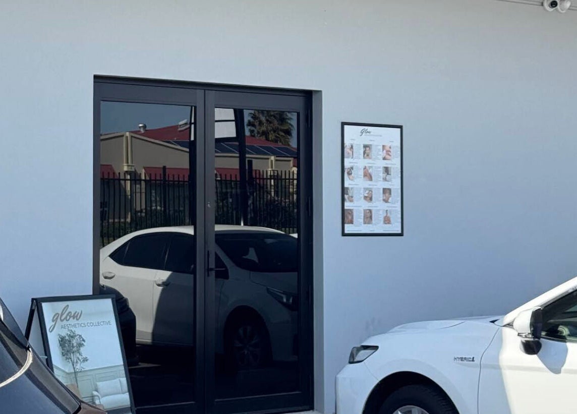 Entrance of Glow Aesthetics Collective, Ingle Farm, South Australia with cars parked nearby.