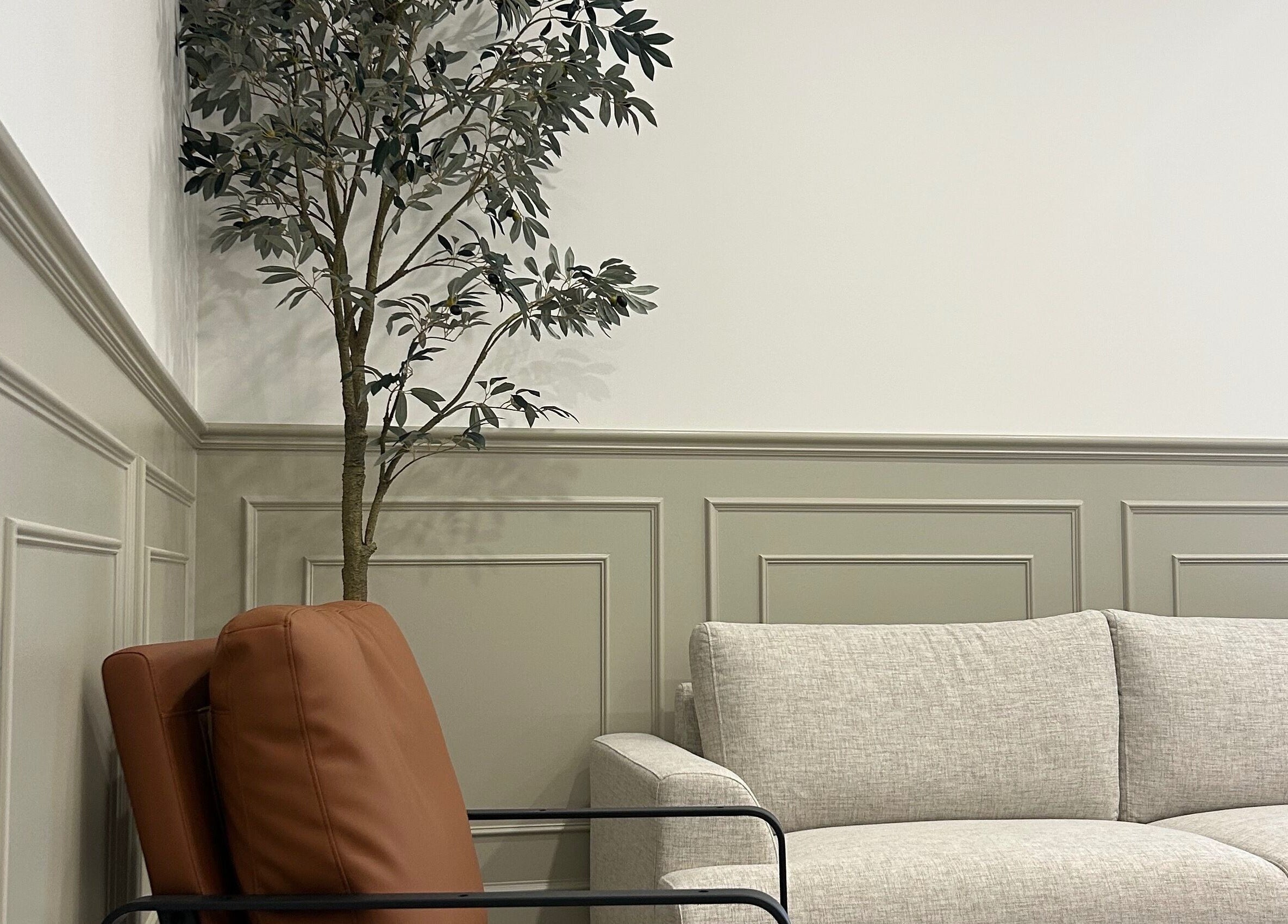 Stylish seating area at Glow Aesthetics Collective, Ingle Farm, South Australia, AU featuring a cozy sofa.