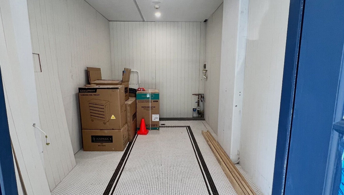 Game Barbershop under setup in Manly, New South Wales, AU. Boxes and tools on the floor.