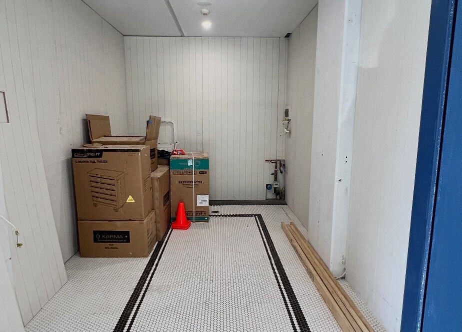 Game Barbershop under setup in Manly, New South Wales, AU. Boxes and tools on the floor.