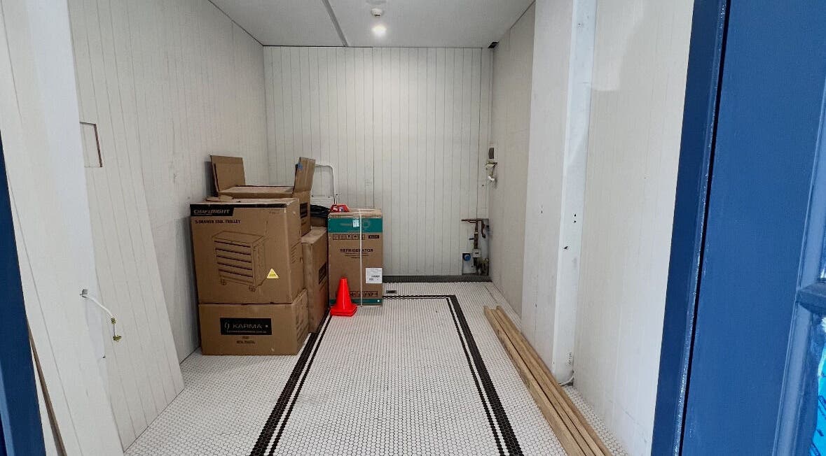 Game Barbershop under setup in Manly, New South Wales, AU. Boxes and tools on the floor.