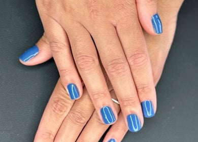 Blue manicured nails at Karina Figueiredo, Brooklyn Park, South Australia, AU.