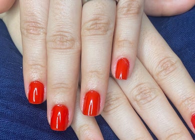 Red manicured nails at Karina Figueiredo in Brooklyn Park, South Australia, AU.