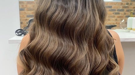 Elegant wavy hairstyle at Paula Amelia Hair Design, Penshurst, New South Wales, AU.
