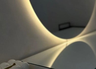 Elegant mirror with soft lighting at Studio4, Lisboa, Lisboa, PT. Modern design enhances the serene ambiance.