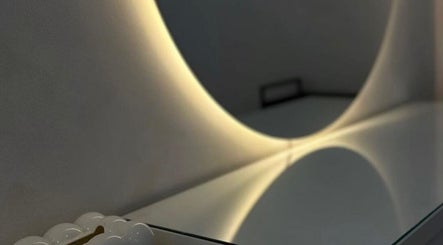 Elegant mirror with soft lighting at Studio4, Lisboa, Lisboa, PT. Modern design enhances the serene ambiance.