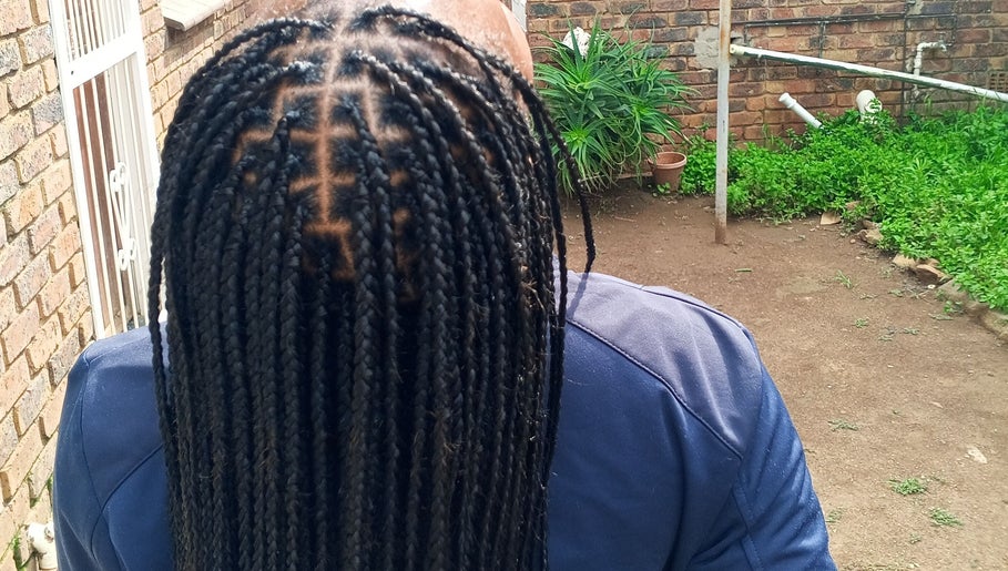 Neat braids showcased at House of Grace Beauty Salon, Johannesburg, Gauteng, ZA, highlighting expert styling.