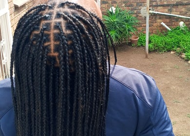 Neat braids showcased at House of Grace Beauty Salon, Johannesburg, Gauteng, ZA, highlighting expert styling.