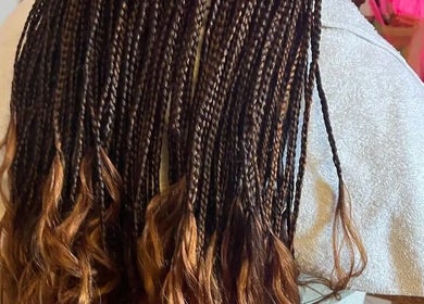 Intricate braids styled at House of Grace Beauty Salon, Johannesburg, Gauteng, ZA.