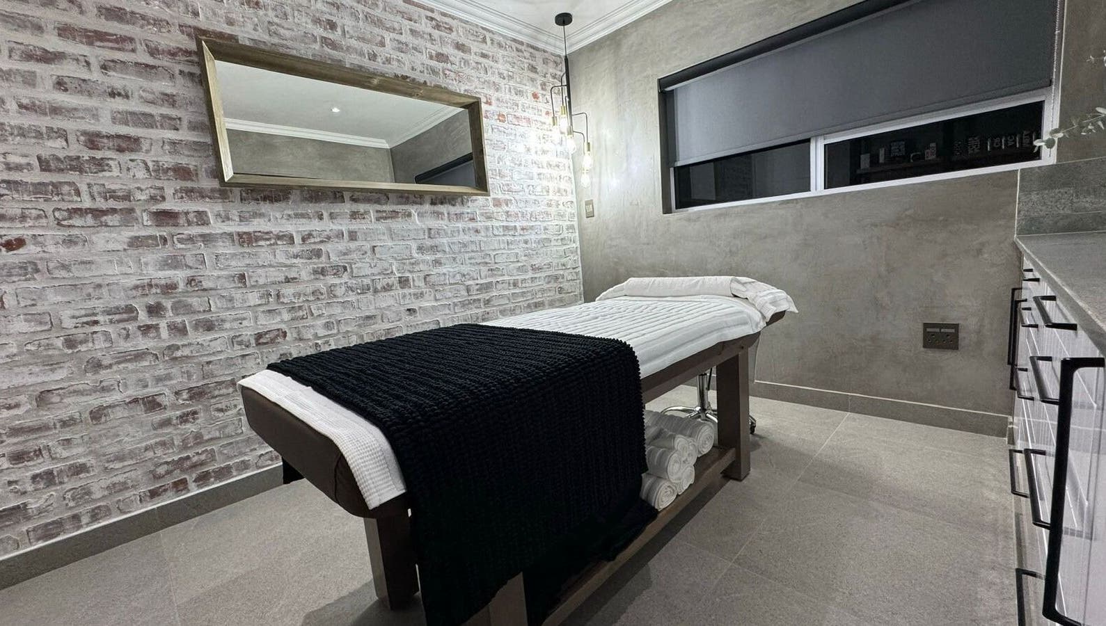 Modern treatment room at Defining Skin Studio, Pretoria, Gauteng, ZA with cozy table and minimalist decor.