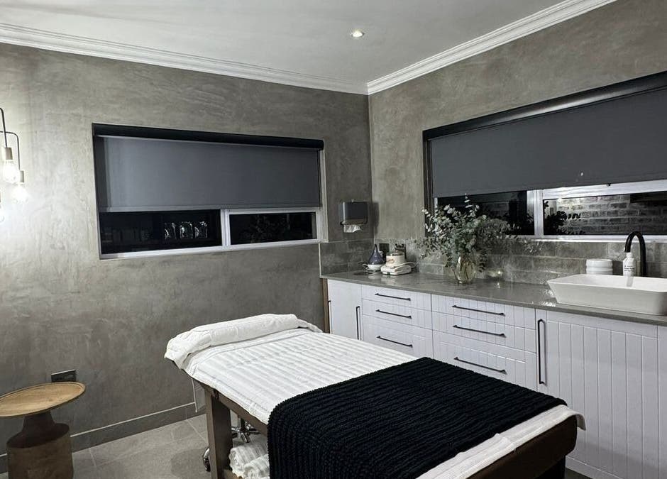 Elegant massage room at Defining Skin Studio, Pretoria, Gauteng, ZA with modern decor and ambient lighting.