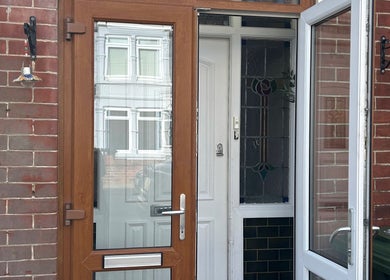 Front entrance of Durose Piercing in Portsmouth, England, GB featuring a modern wooden door.