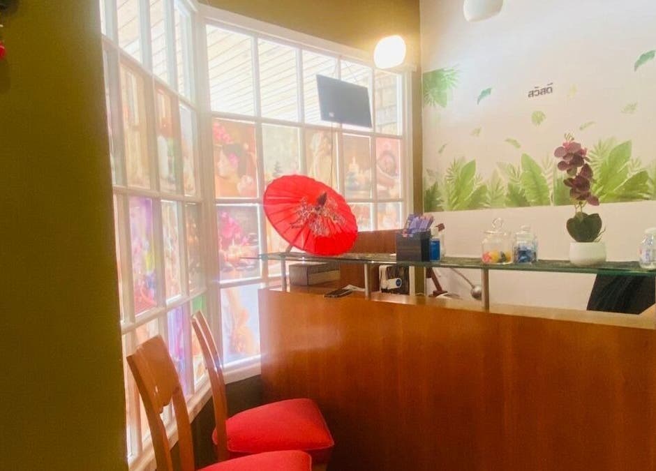 Welcoming reception at Fadia Thai Massage, Cape Town. Features red décor and calming ambiance.