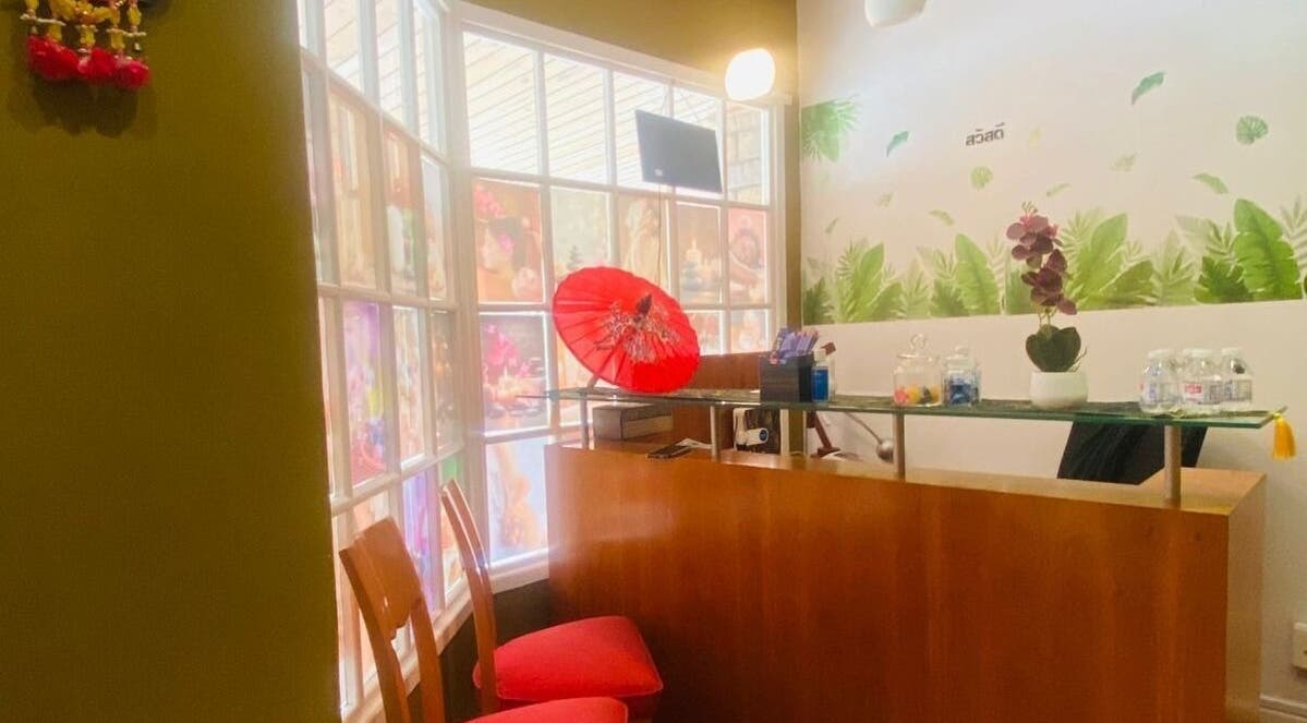 Welcoming reception at Fadia Thai Massage, Cape Town. Features red décor and calming ambiance.