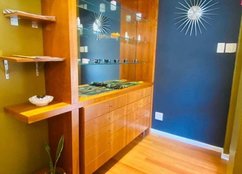 Warm wooden shelves at Fadia Thai Massage, Cape Town, Western Cape, ZA offering serene ambiance and style.