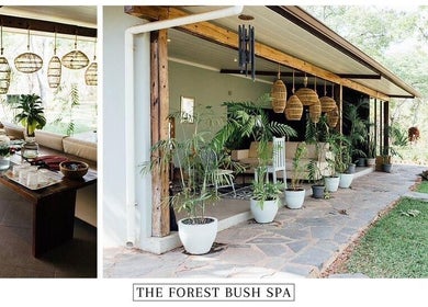 Relaxing outdoor seating at The Forest Bush Spa Zambia, Lusaka, Lusaka Province, ZM, surrounded by lush greenery.