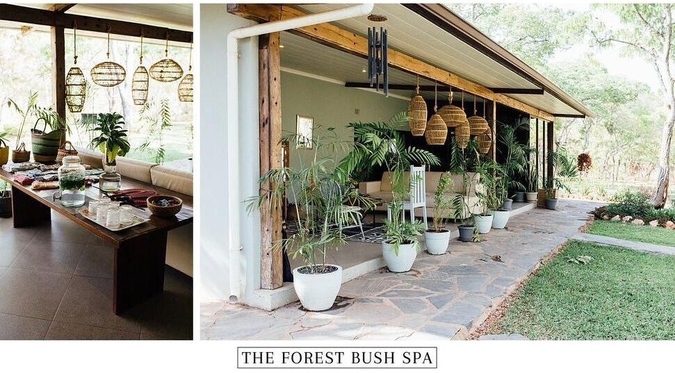Relaxing outdoor seating at The Forest Bush Spa Zambia, Lusaka, Lusaka Province, ZM, surrounded by lush greenery.