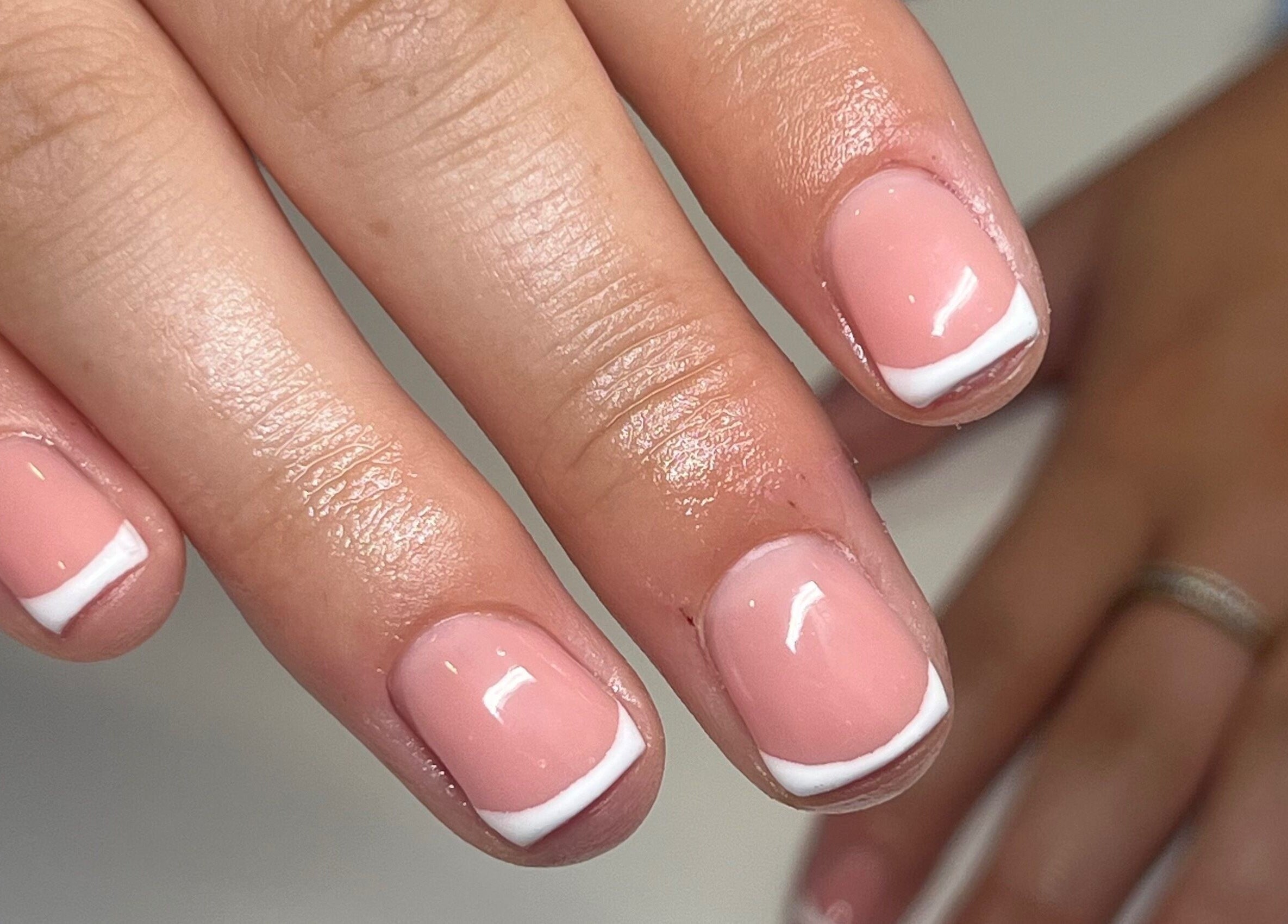Elegant French manicure at KSP beauty bar, Banchory, Scotland, GB, showcasing glossy nail art.
