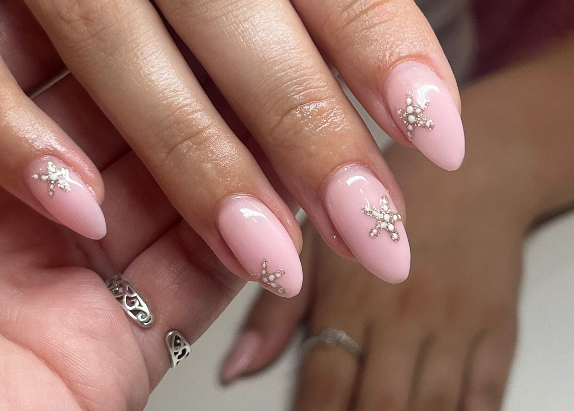 Close-up of elegant pink nail art with gemstones at KSP beauty bar, Banchory, Scotland, GB.