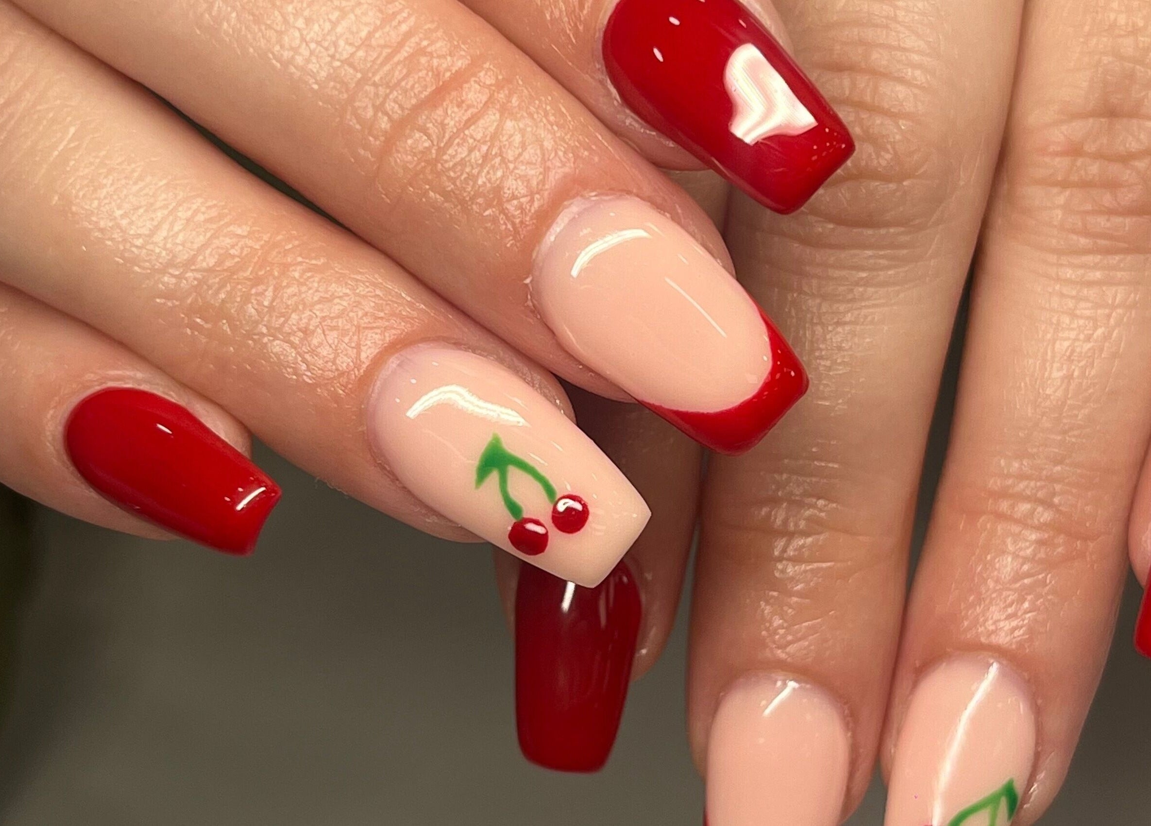 Elegant cherry-themed red nails by KSP beauty bar, Banchory, Scotland, GB.
