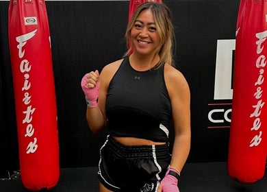 Fitness coach at Honor: Women's Online Fitness Coach, Worksop, England, GB, with boxing gloves.