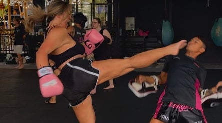 Woman practicing kickboxing at Honor: Women's Online Fitness Coach in Worksop, England, GB.