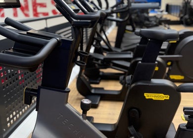 Exercise bikes at Honor: Women's Online Fitness Coach in Worksop, England, GB ready for a dynamic workout.
