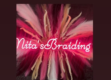 Colorful feather display at Nita’s Braiding, Portsmouth, Saint John Parish, DM, enhancing the salon's ambiance.