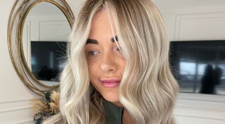 Elegant blonde hair styled at Indy Blonde Hair, Robina, Queensland, AU with soft waves and a polished finish.