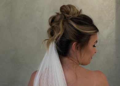 Beautiful bridal updo at Indy Blonde Hair, Robina, Queensland, AU, showcasing expert hairstyling and elegance.