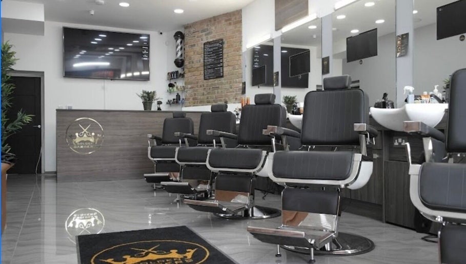 Chic interior of The Original Golden Barbers Ltd in London, England, showcasing modern barber chairs and decor.