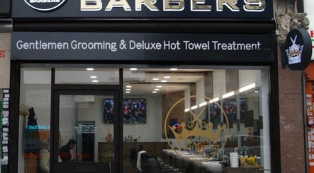 Entrance of The Original Golden Barbers Ltd in London, England, GB showcasing grooming services.