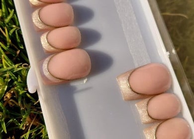 Elegant nude and gold acrylic nails at Nails By Shaaquila, Roodepoort, Gauteng, ZA.