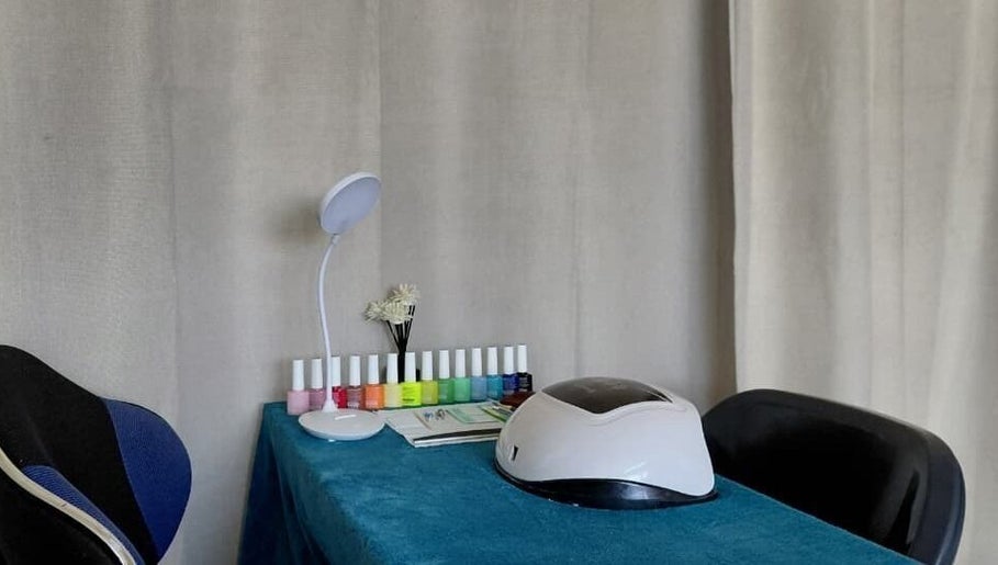 Elegant nail station at Nails By Shaaquila in Roodepoort, Gauteng, ZA with colorful polish display.