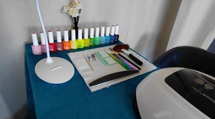 Nail polish selection at Nails By Shaaquila, Roodepoort, Gauteng, ZA, showcasing a vibrant workspace.