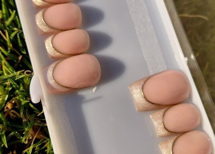 Ombre French nails display on grass at Nails By Shaaquila, Roodepoort, Gauteng, ZA.