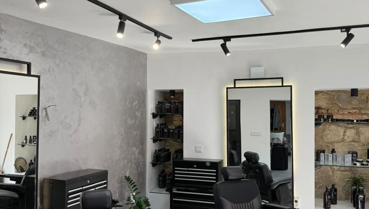 Modern interior of Xtreme Kutz in Varna, Varna, BG, showcasing sleek design and hair care products.