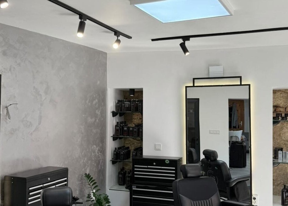 Modern interior of Xtreme Kutz in Varna, Varna, BG, showcasing sleek design and hair care products.