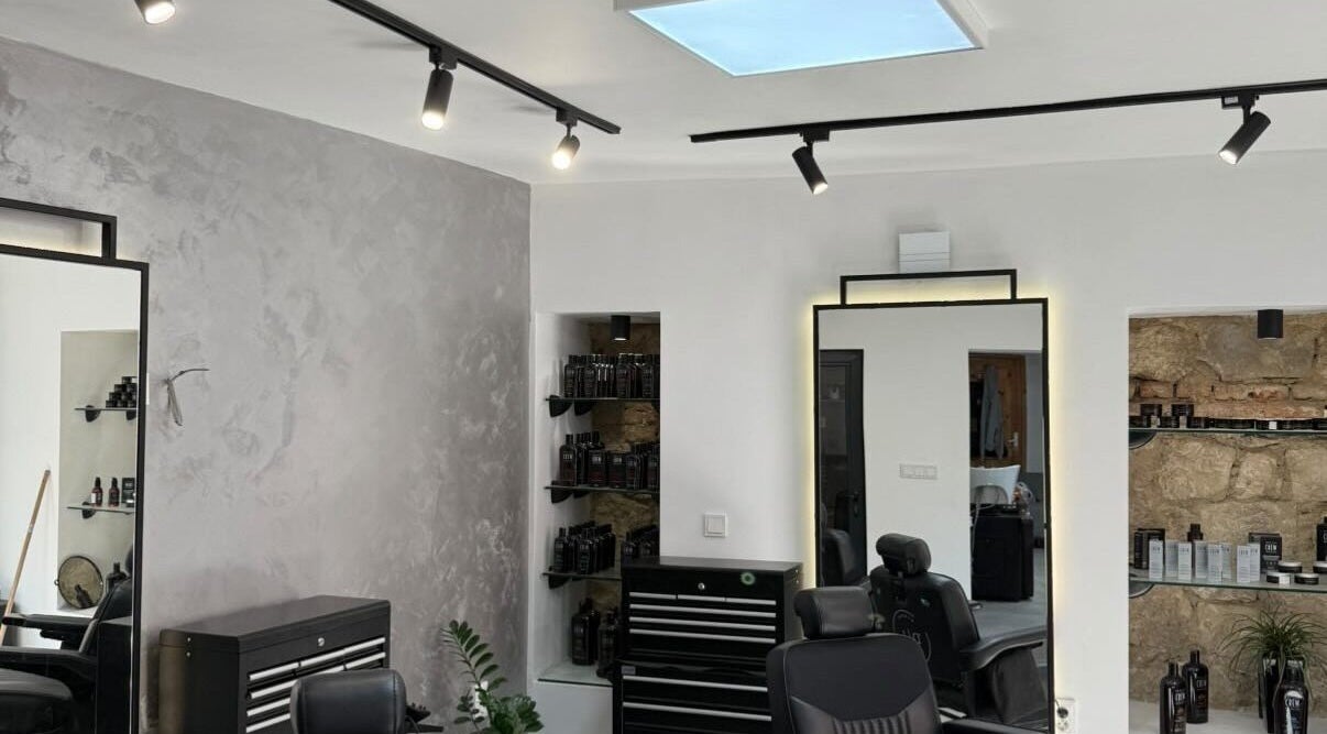 Modern interior of Xtreme Kutz in Varna, Varna, BG, showcasing sleek design and hair care products.