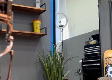 Modern barbershop interior at Fifteencut Barbershop, Portimão, Faro, PT with stylish décor and tools.