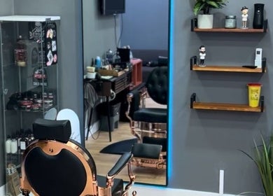 Chic interior of Fifteencut Barbershop, Portimão, Faro, PT showcasing elegant barber chairs and modern decor.