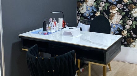 Sophisticated manicure station at Top Coated Lounge in Somerset West, Western Cape, ZA, featuring a floral backdrop.