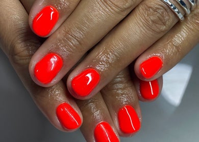 Vibrant red nails at Top Coated Lounge, Somerset West, Western Cape, ZA. Perfect for a bold look.
