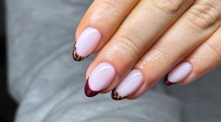 Elegant pink and maroon nail art manicure from NAIAA Studio in Oakham, England, GB.
