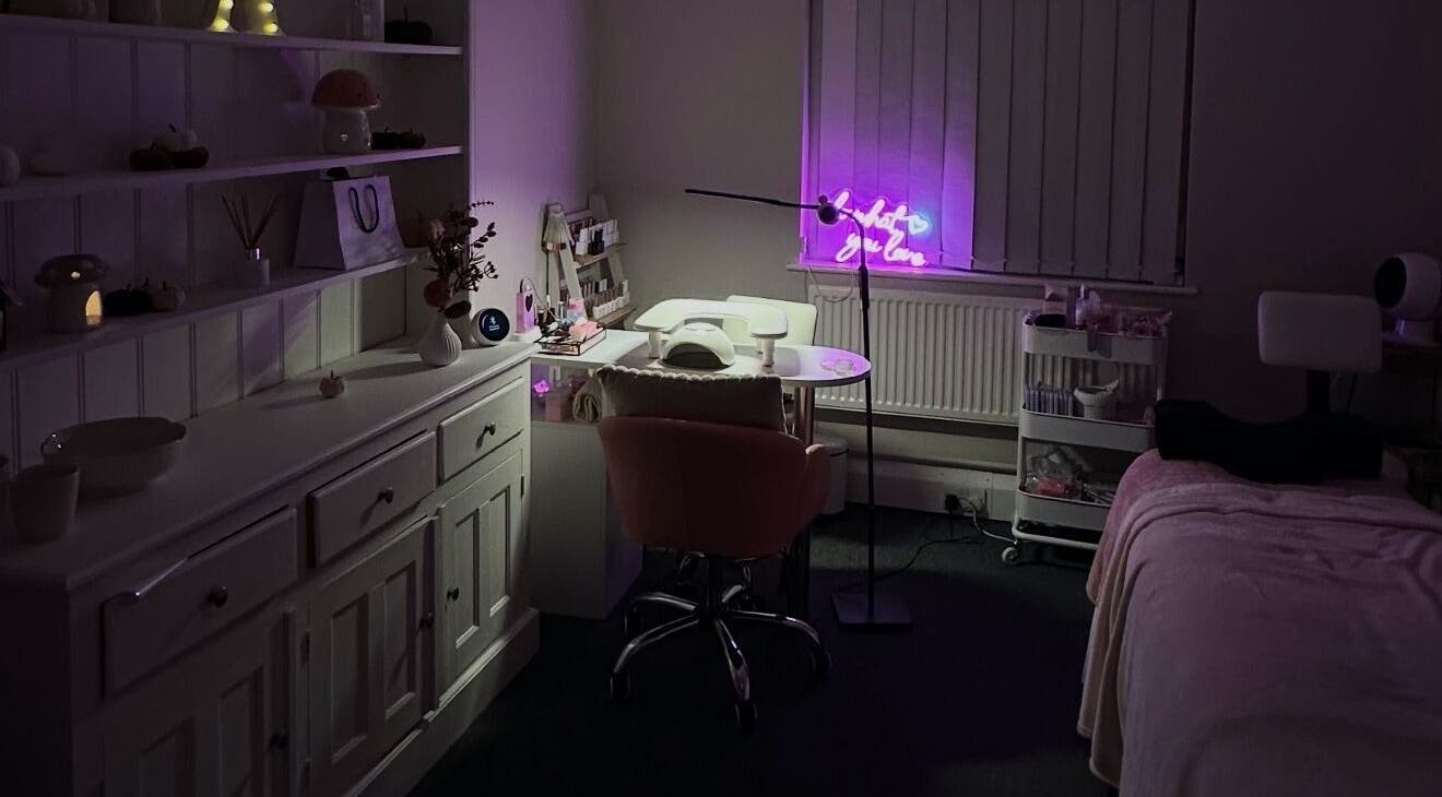 Cozy interior of NAIAA Studio, Oakham, England, featuring a lit workstation and plush seating.