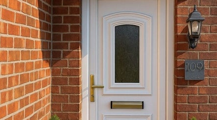 Elegant entrance to Life Holistics, North Shields, England, GB with white door and brick walls.
